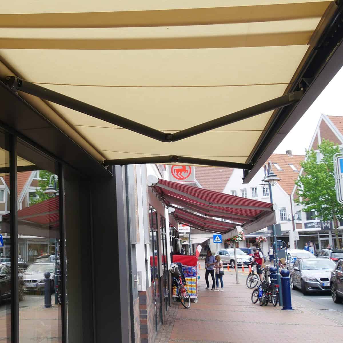 markilux 3300 full cassette awning proviing shelter for customers to this shop