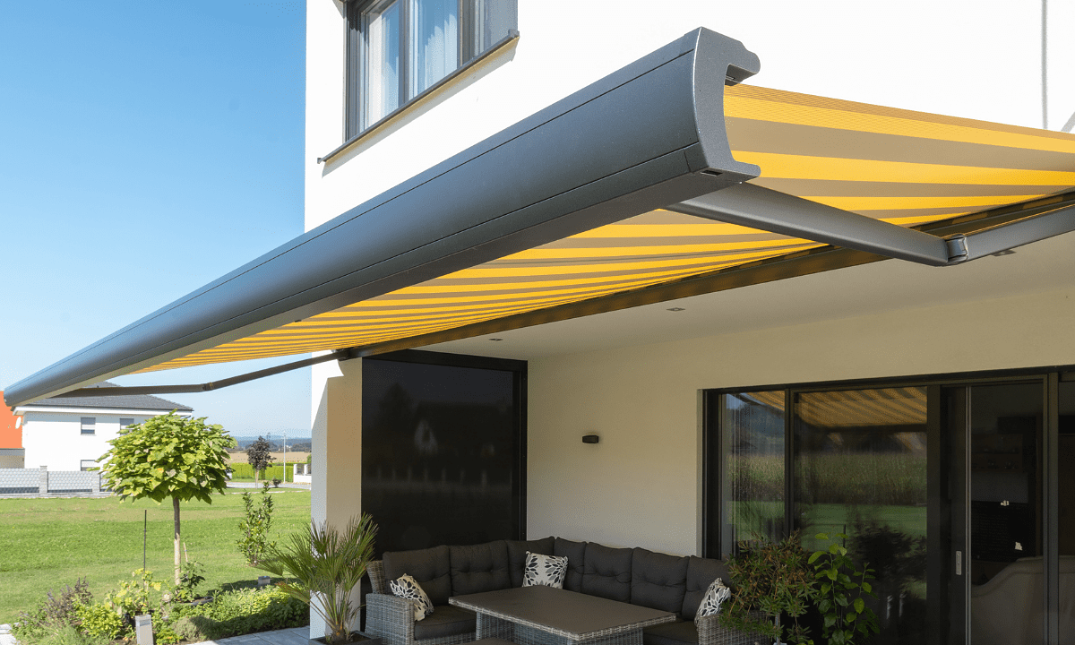 MX1 awning, extended in yellow and grey stripes