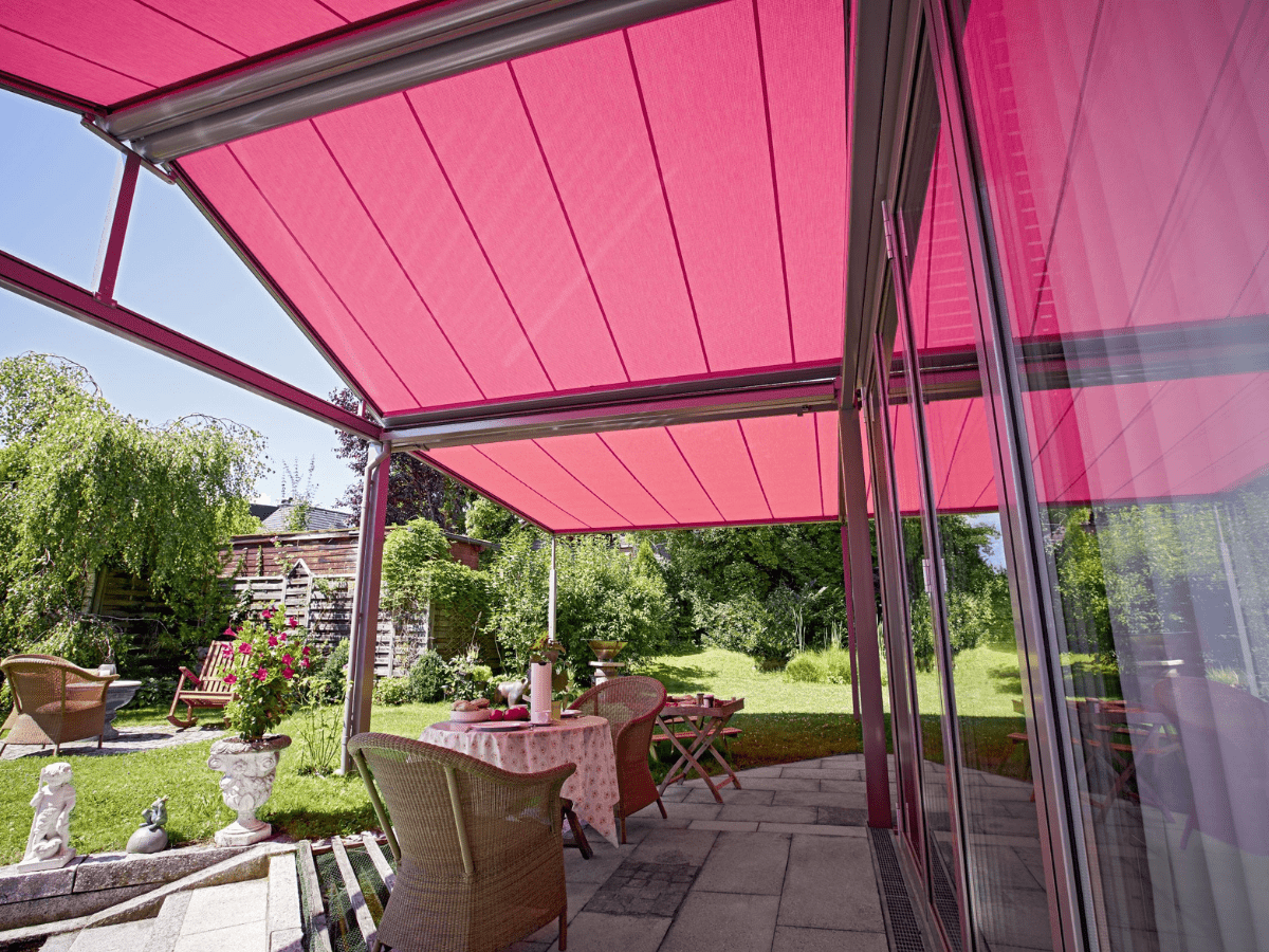 markilux pergola awning in deep red shading a patio