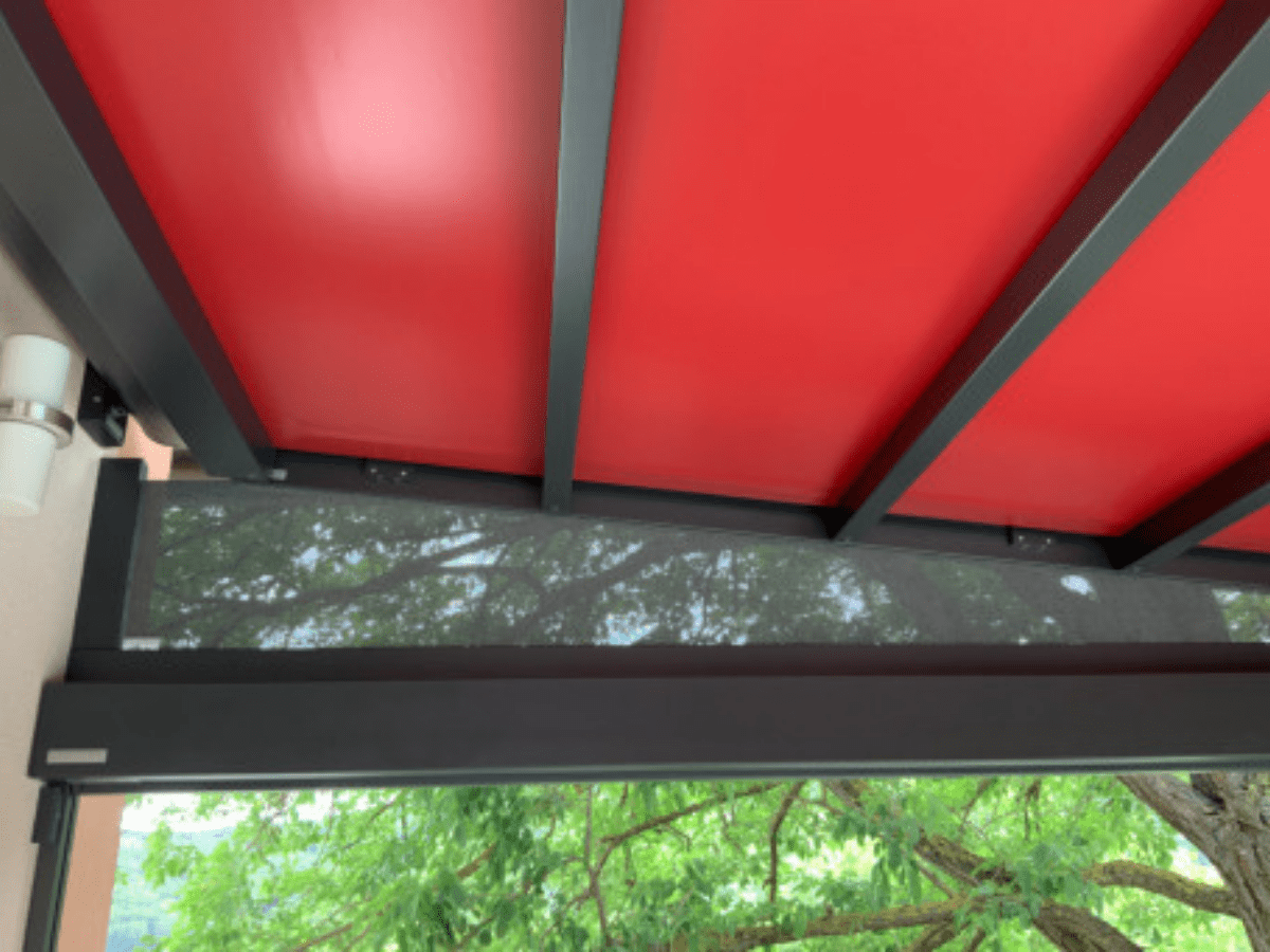 markilux stretch red fabric awning stretched across frame