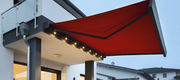 Weinor Kubata awning with LED lighting in red, wall mounted