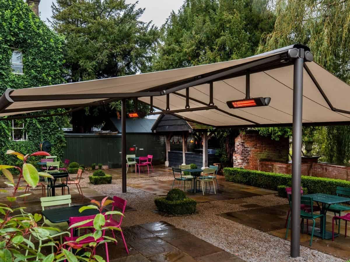 heaters attached to a commercial pergola for outdoor dining