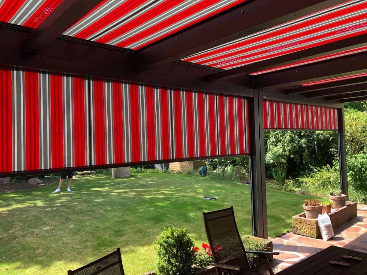 markilux markant pergola awning system with colourful zip screen sides to match the retractable roof