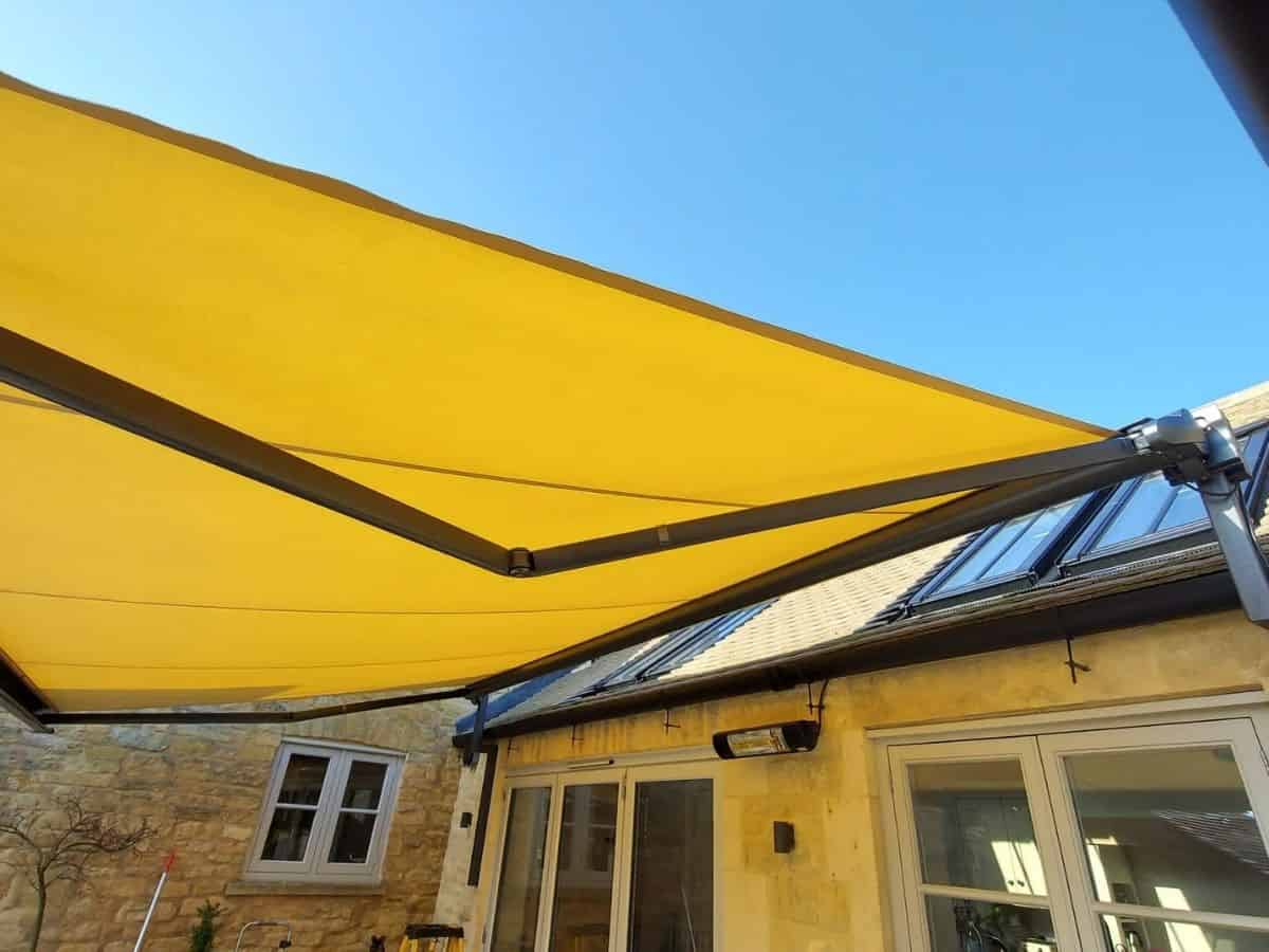 A markilux 990 waterproof fabric awning fitted to a house in Moreton-In-Marsh, Gloucs