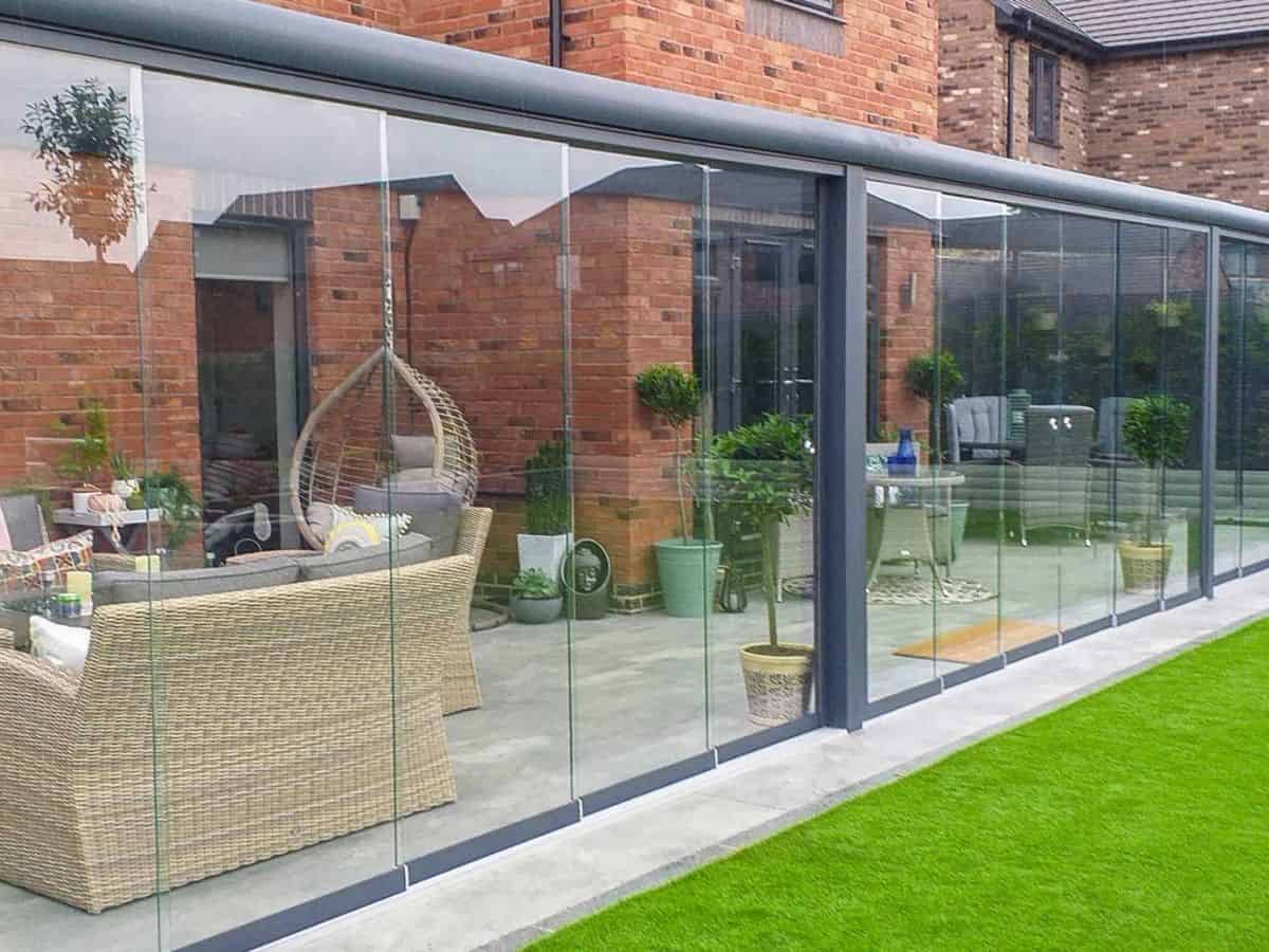 Cotswolds Modern wall mounted glass room with sliding doors