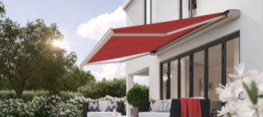 Makilux MX-2 in red wall mounted above patio
