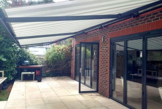 The Markilux 5010 awning installed at a home in Reading offers both convenience and comfort with its remote control and wind & rain sensor, providing a seamless and enjoyable outdoor living experience.