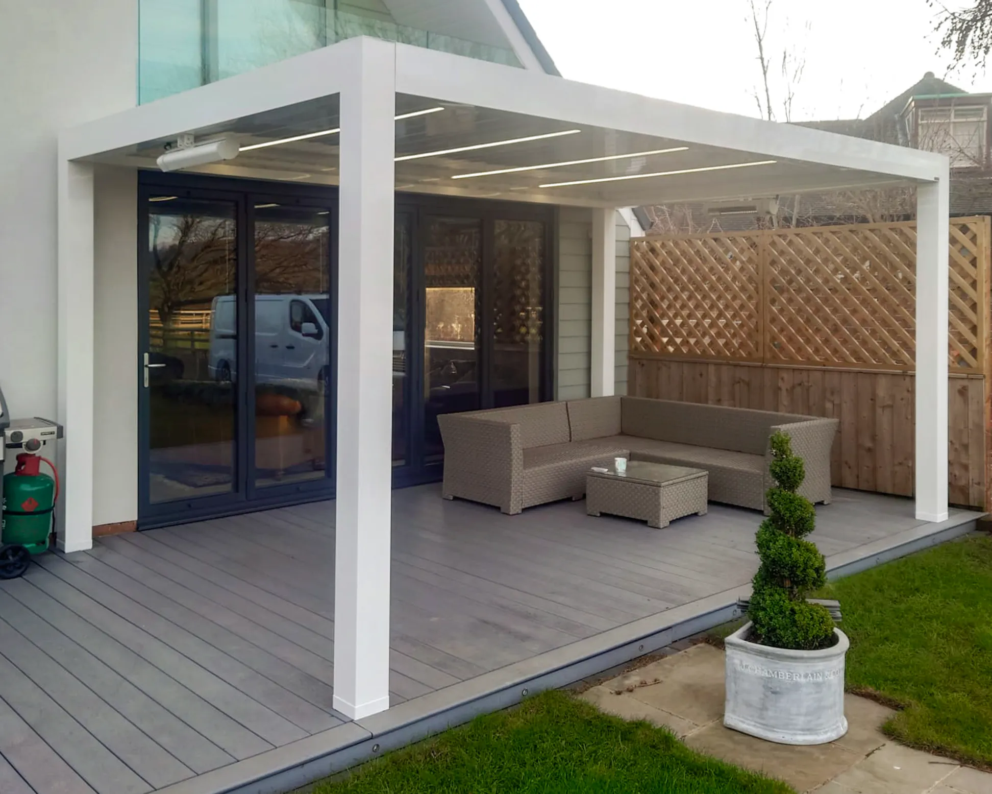 Cotswold's installation in Middlesbrough of SeeSky-Bio Louvred Roof Pergola with LED lights on