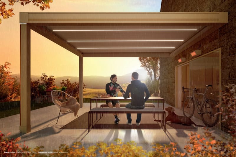 Make the most of your outdoor space in any weather with the Weinor Artares louvred roof pergola, as seen in this image with two friends chatting and smiling underneath while sheltered from the rain. This pergola provides the perfect combination of style and function, with its solid construction and convenient louvred roof that can be adjusted to provide shade and ventilation, even in rainy or stormy weather. Whether you're hosting a gathering or simply enjoying a moment of relaxation, this pergola adds value and elegance to your outdoor space, allowing you to create lasting memories with loved ones.