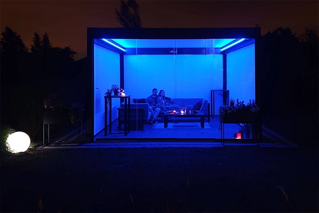 Tarasola illuminated by dark blue LED perimeter lighting.