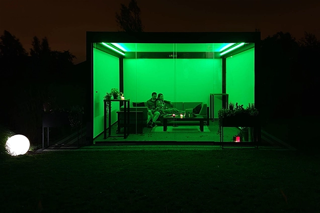 Tarasola bathed in green LED perimeter lighting.