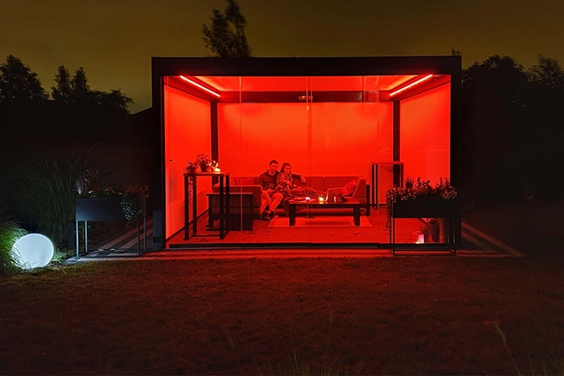 Tarasola illuminated with red LED perimeter lighting.